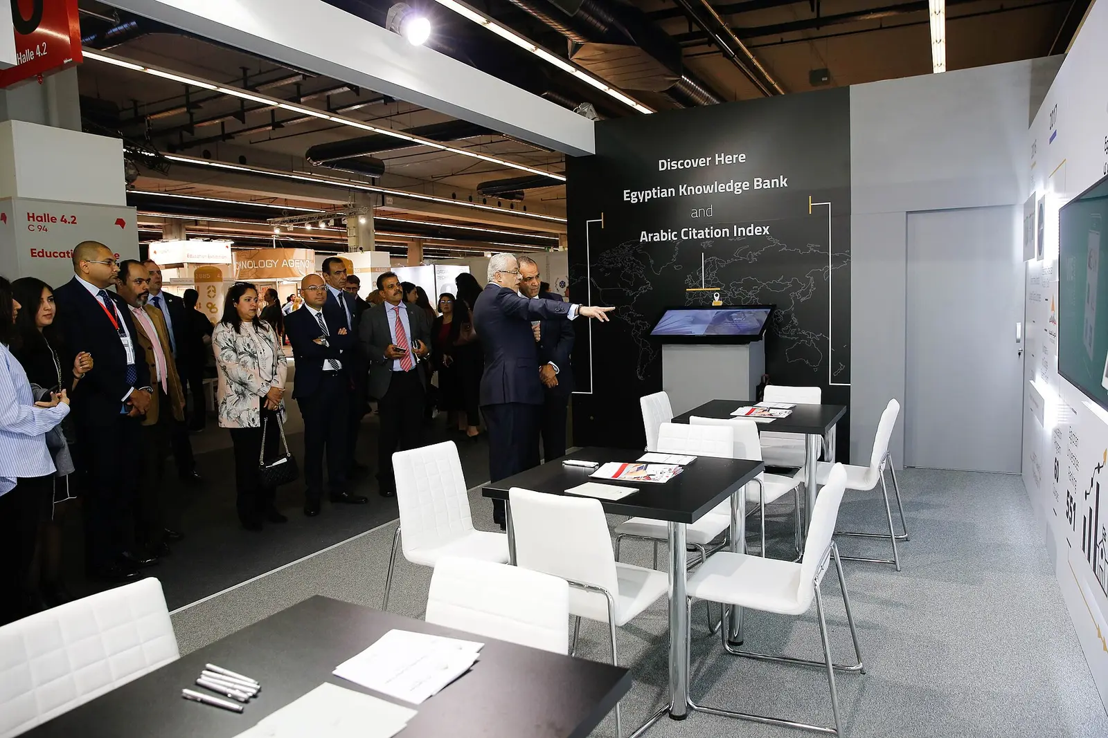 Exhibition stand and visitors inside a hall at the Egypt International Exhibition Center, Cairo